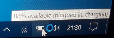 Windows battery icon with mouseover text “88% available (plugged in, charging)”.