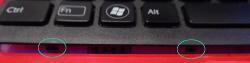 Picture of the clips at the bottom left of the keyboard between Ctrl and Fn and between Alt and the spacebar