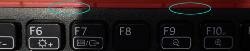 Picture of the clips at the top middle of the keyboard between F6 and F7 and near F9